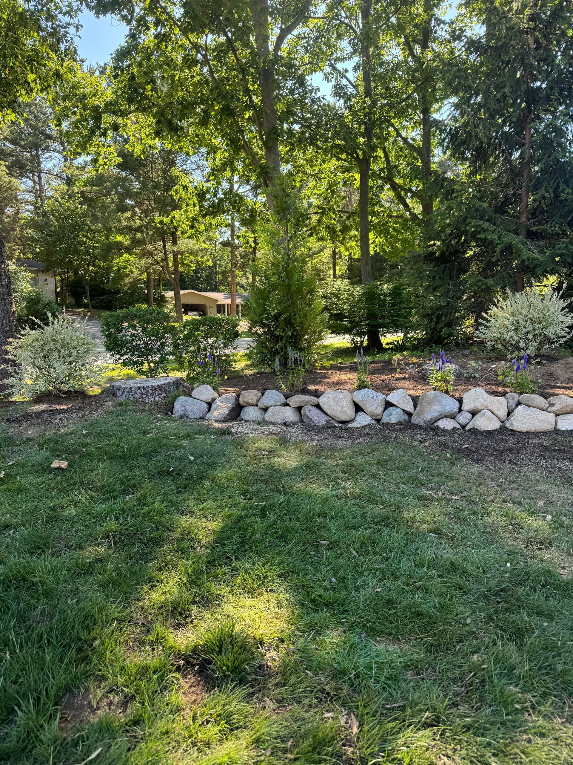 Boulder Edging and New Plantings Give These Beds a Finished Look image